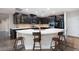 Modern kitchen with black cabinets, white countertops and stainless steel appliances at 3934 Sangre De Cristo Ave, Las Vegas, NV 89118