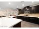 Kitchen with a spacious island, dark wood cabinetry, stainless steel appliances, and modern countertops at 3934 Sangre De Cristo Ave, Las Vegas, NV 89118