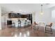Open-concept kitchen features dark cabinets, a large island, and a cozy breakfast nook at 3934 Sangre De Cristo Ave, Las Vegas, NV 89118