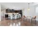 Spacious kitchen with dark wood cabinets, stainless steel appliances, and a center island with seating at 3934 Sangre De Cristo Ave, Las Vegas, NV 89118