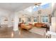Bright and airy living room with large windows, comfortable seating, and modern finishes at 3934 Sangre De Cristo Ave, Las Vegas, NV 89118