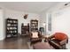 Cozy living room with bookshelves, comfortable seating, and a warm, inviting ambiance at 3934 Sangre De Cristo Ave, Las Vegas, NV 89118
