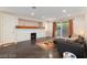 Cozy living room featuring a fireplace, sliding glass doors, and comfortable seating at 3934 Sangre De Cristo Ave, Las Vegas, NV 89118