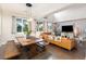 Open living space featuring a dining area, high ceilings, stylish furnishings, and desert-themed wallpaper at 3934 Sangre De Cristo Ave, Las Vegas, NV 89118