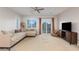 Bright living room with a daybed, a sliding glass door, and a ceiling fan at 3934 Sangre De Cristo Ave, Las Vegas, NV 89118