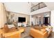 Inviting living room featuring soaring ceilings, stylish furnishings, and abundant natural light at 3934 Sangre De Cristo Ave, Las Vegas, NV 89118
