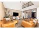 Bright, open living room with a statement wall, comfortable seating, and views of the home's grand entry at 3934 Sangre De Cristo Ave, Las Vegas, NV 89118