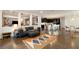 Open floor plan seamlessly connecting the living room, kitchen, and dining area for modern living at 3934 Sangre De Cristo Ave, Las Vegas, NV 89118
