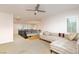 Carpeted loft area with modern railings, stylish daybed, and bright natural light at 3934 Sangre De Cristo Ave, Las Vegas, NV 89118