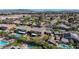 Nice neighborhood view featuring lush greenery, and community pools with a mountain backdrop at 3934 Sangre De Cristo Ave, Las Vegas, NV 89118