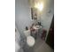 Functional bathroom with a pedestal sink, medicine cabinet, and tiled floors at 4030 E Carey Ave, Las Vegas, NV 89115