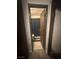 Bathroom view through a doorway featuring a dark shower curtain at 4030 E Carey Ave, Las Vegas, NV 89115