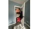 A glimpse inside the bedroom closet filled with assorted household items at 4030 E Carey Ave, Las Vegas, NV 89115