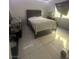 Bedroom with tile floors and fish tank in front of window at 4030 E Carey Ave, Las Vegas, NV 89115