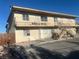 Two-story building with open balcony, stairs and front entrance at 4030 E Carey Ave, Las Vegas, NV 89115