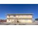 Two-story building with open balcony, and outside stairs at 4030 E Carey Ave, Las Vegas, NV 89115