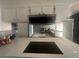 The kitchen has a built in microwave and gives a view into the living room at 4030 E Carey Ave, Las Vegas, NV 89115