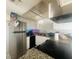 Updated kitchen featuring granite countertops, stainless steel appliances, and tiled backsplash at 4030 E Carey Ave, Las Vegas, NV 89115