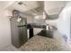 Updated kitchen featuring granite countertops, stainless steel appliances, and tiled backsplash at 4030 E Carey Ave, Las Vegas, NV 89115