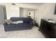 Living room with tile floors, sofa, and dresser at 4030 E Carey Ave, Las Vegas, NV 89115