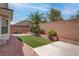 Private backyard with turf, patio, and brick wall fencing at 4140 Gliding Gulls Ave, North Las Vegas, NV 89084