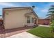 Relaxing backyard with low maintenance landscape, turf, and partial covering at 4140 Gliding Gulls Ave, North Las Vegas, NV 89084