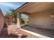 View of the covered patio, paver area, and grassy area in the backyard at 4140 Gliding Gulls Ave, North Las Vegas, NV 89084