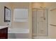 Bright bathroom features a soaking tub and glass enclosed shower with chrome fixtures at 4140 Gliding Gulls Ave, North Las Vegas, NV 89084