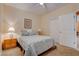 Bedroom features a ceiling fan, neutral decor, and closet at 4140 Gliding Gulls Ave, North Las Vegas, NV 89084