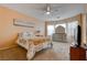 Bright bedroom with dresser, large window, and a comfortable bed at 4140 Gliding Gulls Ave, North Las Vegas, NV 89084