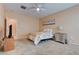 Cozy bedroom with ceiling fan, carpet flooring, and comfortable decor at 4140 Gliding Gulls Ave, North Las Vegas, NV 89084