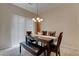 Cozy dining area featuring a dark wood table set and lots of light at 4140 Gliding Gulls Ave, North Las Vegas, NV 89084