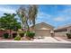 Charming single-story home featuring desert landscaping and a two-car garage at 4140 Gliding Gulls Ave, North Las Vegas, NV 89084
