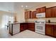 Well-equipped kitchen with modern appliances and dark wood cabinetry at 4140 Gliding Gulls Ave, North Las Vegas, NV 89084