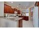 Well-equipped kitchen with granite countertops and dark wood cabinetry at 4140 Gliding Gulls Ave, North Las Vegas, NV 89084