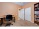 Office with desk, rolling chair and ample storage and access to more rooms at 4140 Gliding Gulls Ave, North Las Vegas, NV 89084