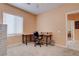 Office with desk, rolling chair and ample natural light from a large window at 4140 Gliding Gulls Ave, North Las Vegas, NV 89084
