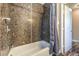Modern bathroom featuring a shower and tub with stylish tile surround and updated fixtures at 417 Wisteria Ave, Las Vegas, NV 89107