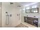 Modern bathroom featuring a spacious walk-in shower with dual showerheads and a double vanity at 417 Wisteria Ave, Las Vegas, NV 89107