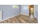 Bright bedroom with wood flooring, and an entrance to another room at 417 Wisteria Ave, Las Vegas, NV 89107
