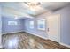 Cozy bedroom with dual windows and laminate wood flooring featuring a ceiling fan at 417 Wisteria Ave, Las Vegas, NV 89107