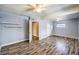 Spacious bedroom featuring modern wood floors, a ceiling fan, and neutral paint creating a comfortable retreat at 417 Wisteria Ave, Las Vegas, NV 89107
