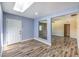 Inviting entryway with stylish flooring, skylight, and a large pane glass allowing a light filled space at 417 Wisteria Ave, Las Vegas, NV 89107