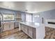 Bright kitchen featuring stainless steel appliances, stylish cabinetry, and a large island with a sleek countertop at 417 Wisteria Ave, Las Vegas, NV 89107