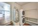 Convenient laundry area equipped with stacked washer/dryer and utility sink offering practicality and efficiency at 417 Wisteria Ave, Las Vegas, NV 89107