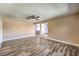 Spacious living room featuring modern wood floors, a ceiling fan, and neutral paint, creating a welcoming atmosphere at 417 Wisteria Ave, Las Vegas, NV 89107