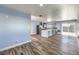 Open living area with wood flooring, stainless steel appliances, and natural light at 417 Wisteria Ave, Las Vegas, NV 89107