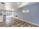 Bright living area with modern fireplace and wood-look flooring at 417 Wisteria Ave, Las Vegas, NV 89107