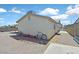A clear backyard view reveals a home's exterior, two bikes, and an awaiting empty canvas at 421 Engel Ave, Henderson, NV 89011