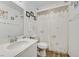 Bathroom featuring a single sink vanity, toilet and shower with decorative curtain at 421 Engel Ave, Henderson, NV 89011
